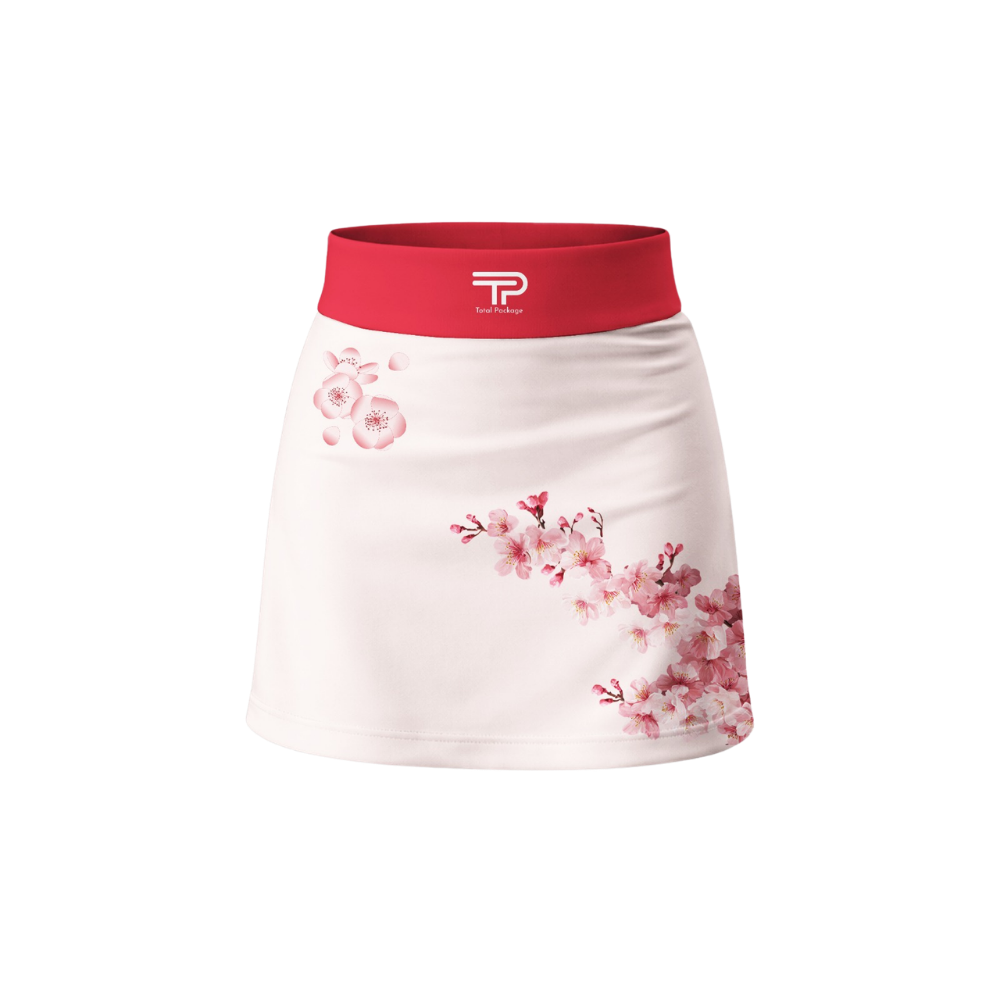 White skirt with pink floral pattern and red waistband on a white background
