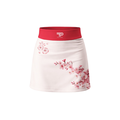 White skirt with pink floral pattern and red waistband on a white background