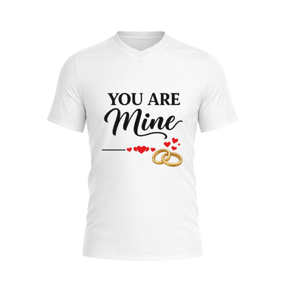 White t-shirt with 'You Are Mine' text and wedding rings design on a white background