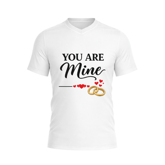 White t-shirt with 'You Are Mine' text and wedding rings design on a white background