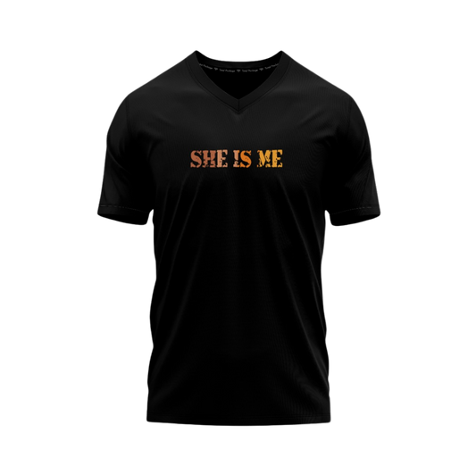 Black V-neck t-shirt with 'SHE IS ME' text in orange on a white background